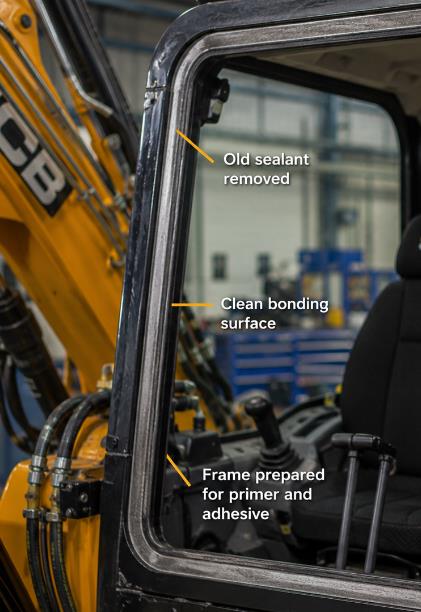 Clean JCB excavator cab frame aperture prepared for new bonded glass installation